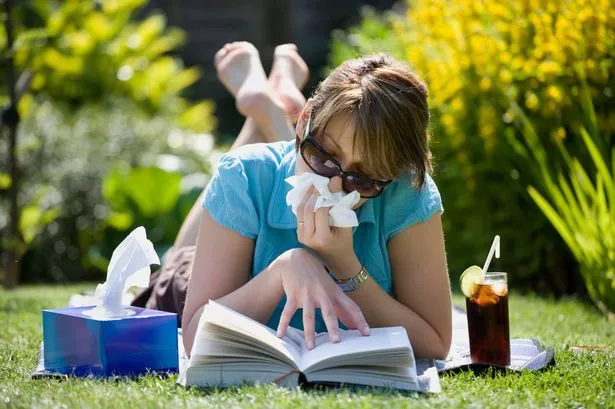 2 Woman Blowing Her Nose