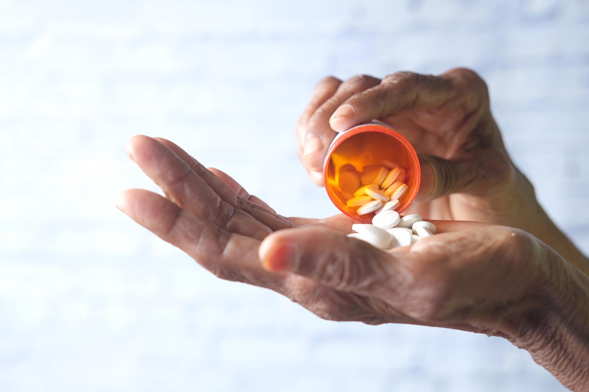 Senior Hands Medicine Pills Close