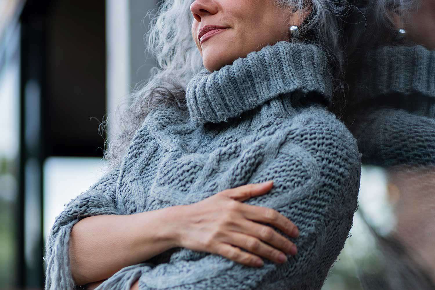 woman leaning against wall 060225 6ba03675b12045639e0b3abcab06f272