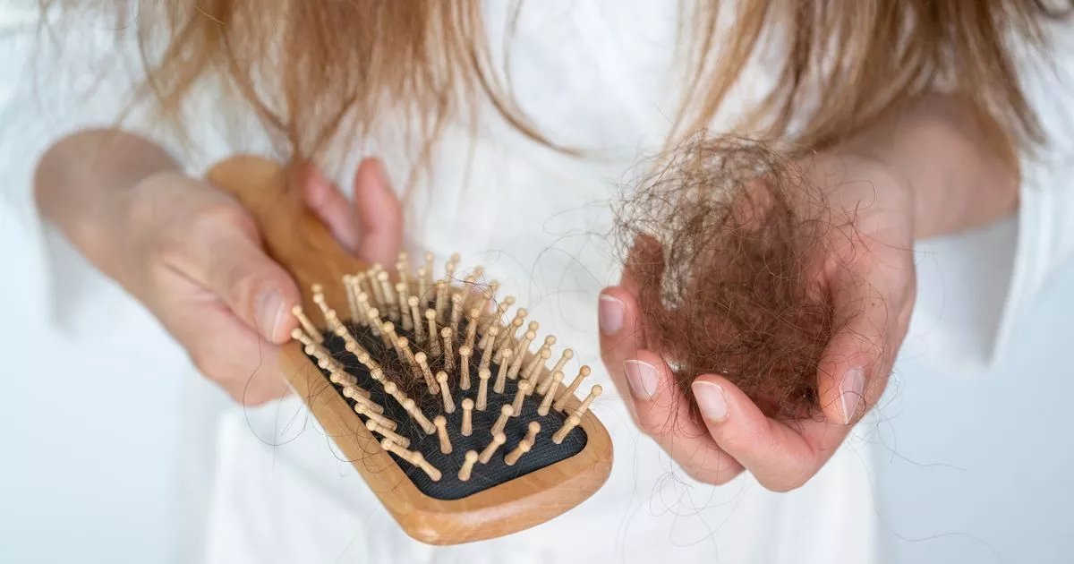 0 Person collecting hair from their brush