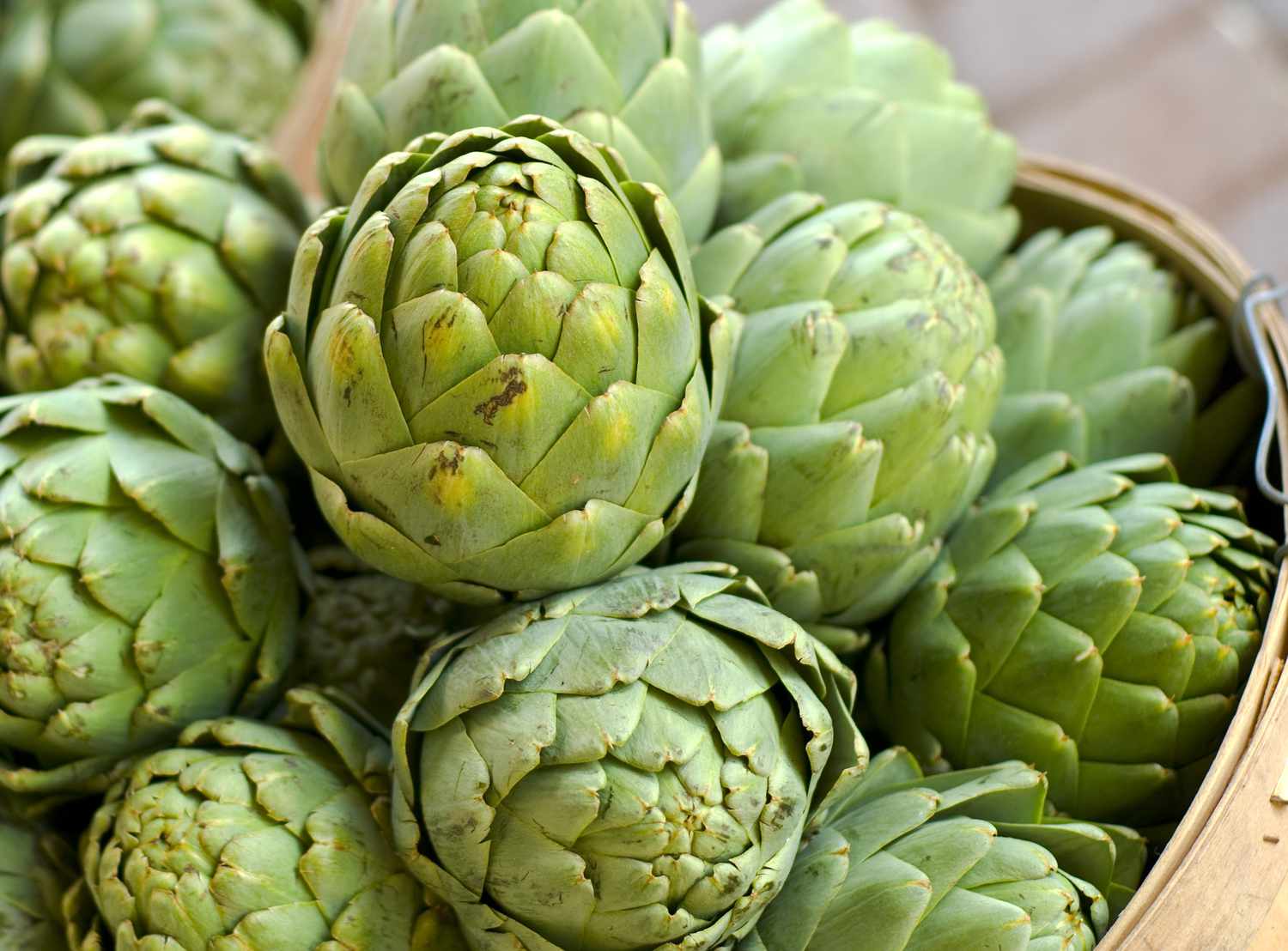 artichoke in baskets fresh spring vegetables at farmer s market 157315654 5aeb017ba18d9e0037f1af98