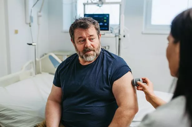 0 Man being treated by a doctor
