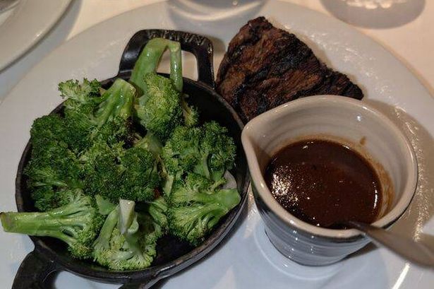 0 Broccoli steak and gravy on a plate