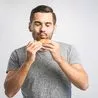 0 Young man holding a piece of hamburger