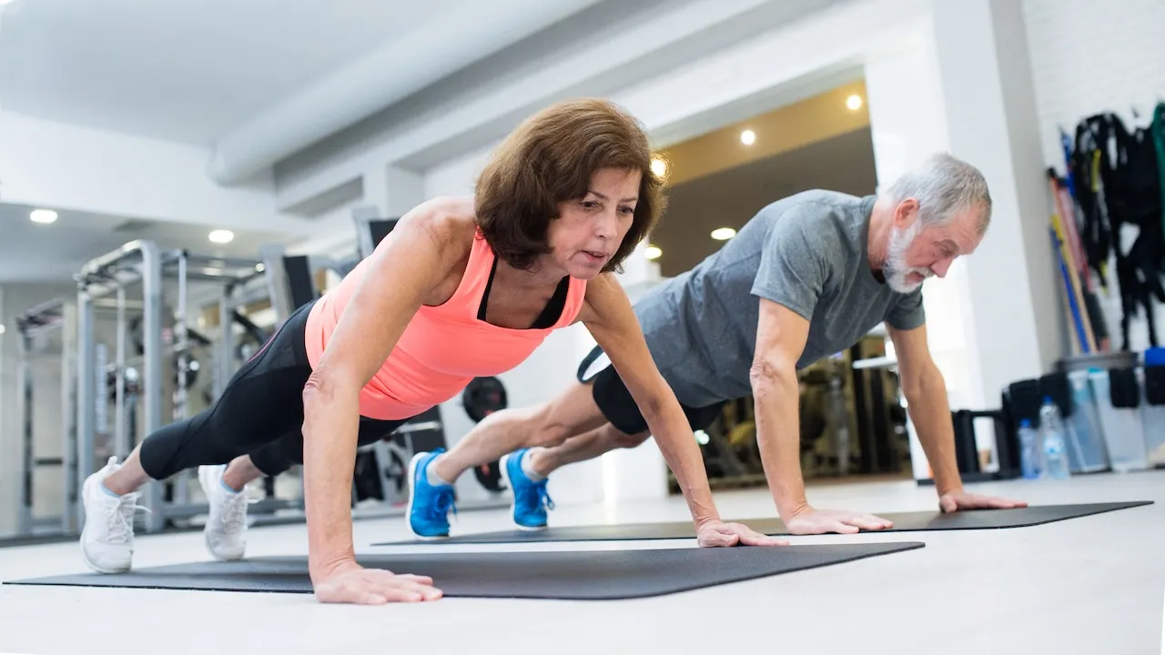 older couple doing push ups