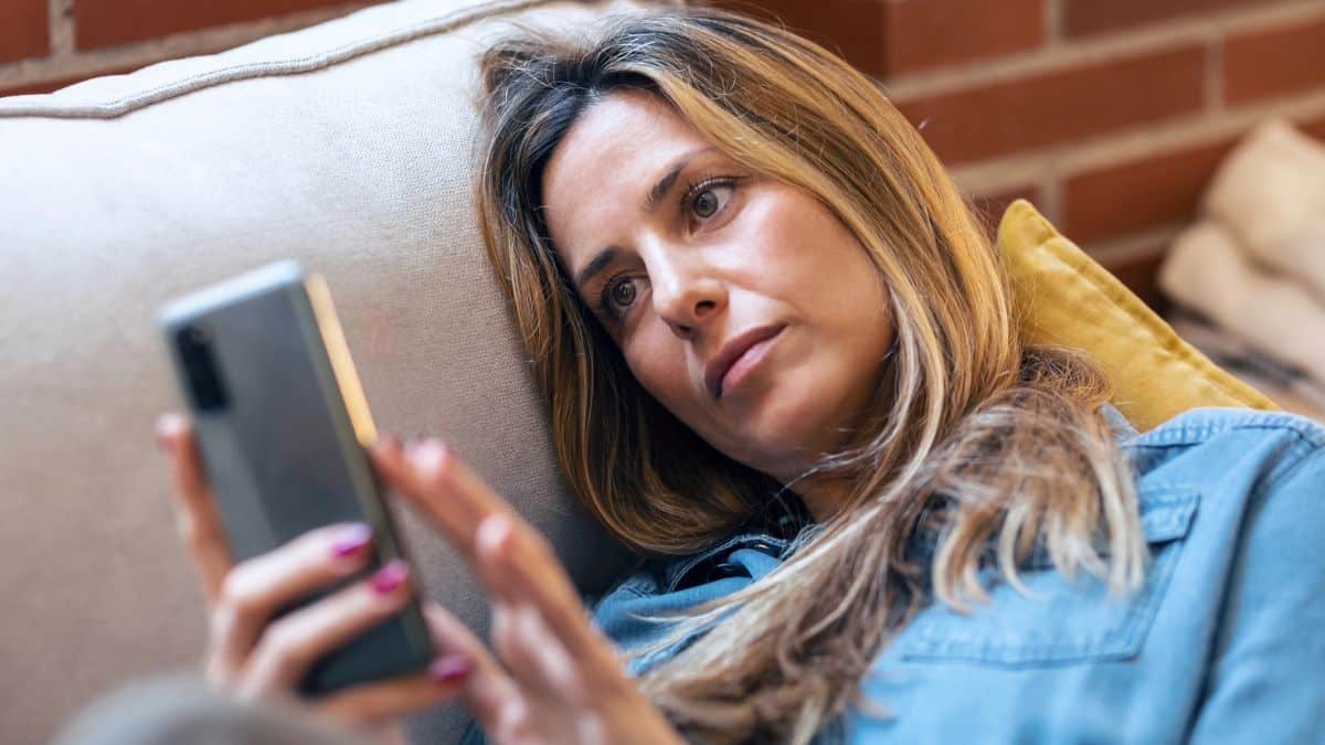woman staring at her phone