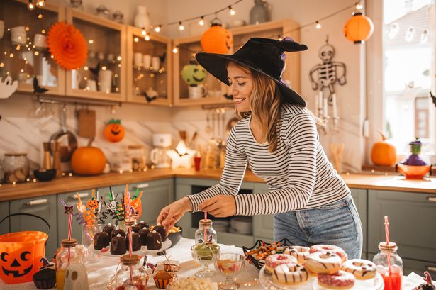 1 Person setting out Halloween snacks