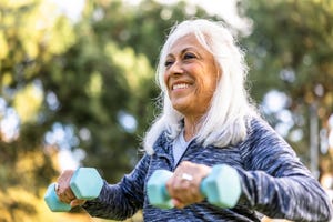 Want to Stay Active as You Age? These Exercises Can Help 1 older adult lifting weights