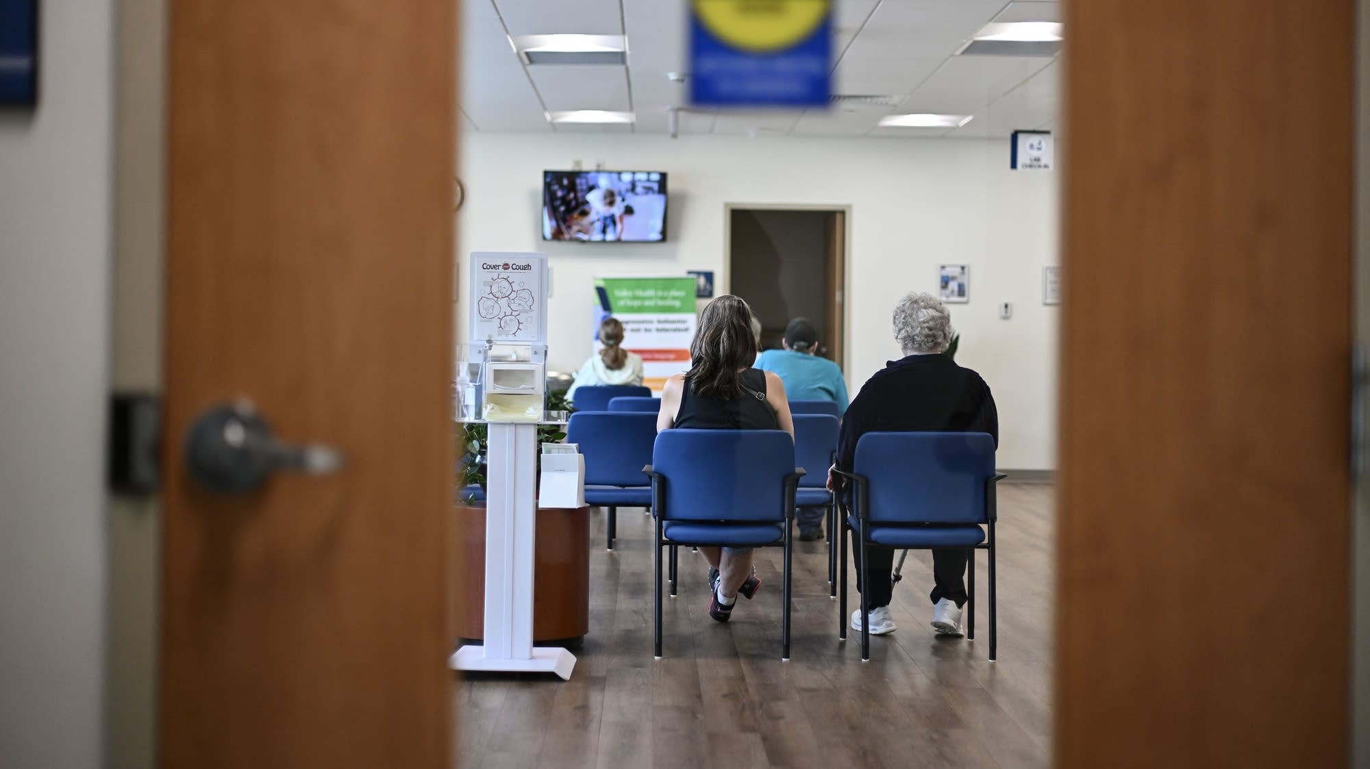 Whats going on with health insurance in Minnesota? - MPR News 5 95afbf 20250711 people sit and wait in an emergency room 2000