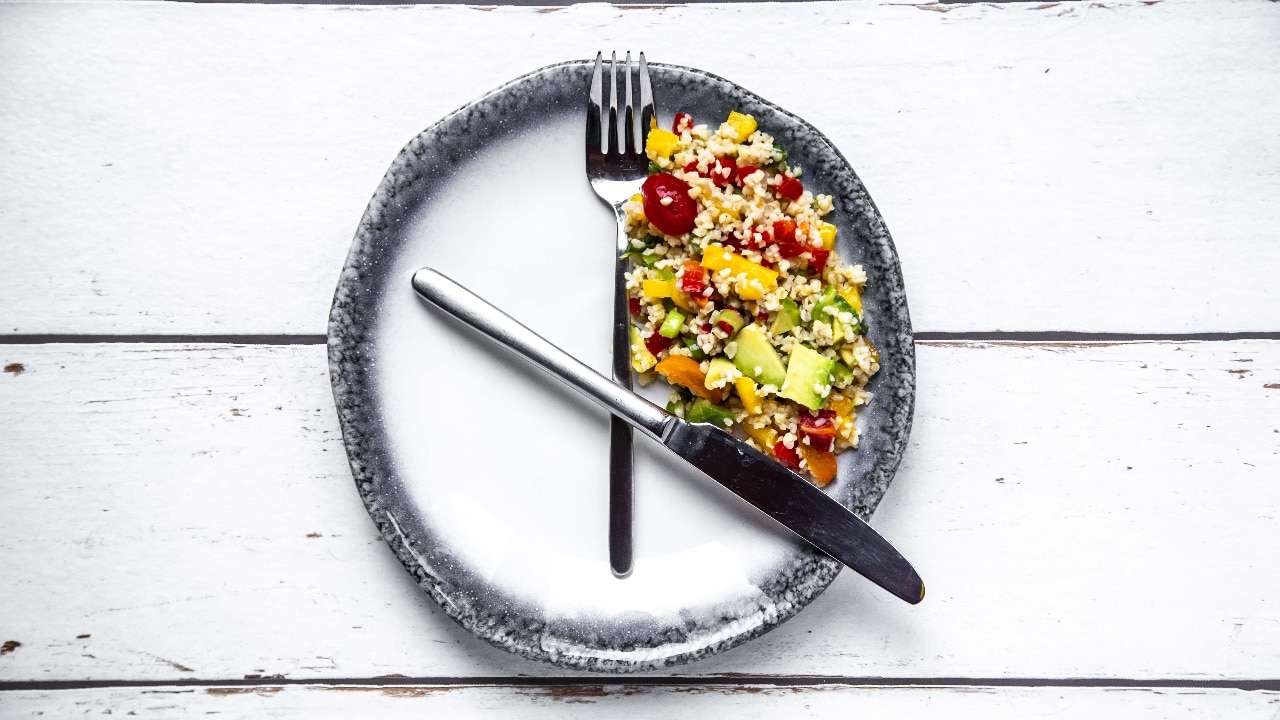 bulgar salad on round plate symbol for intermittent fasting 191151366 16x9 1