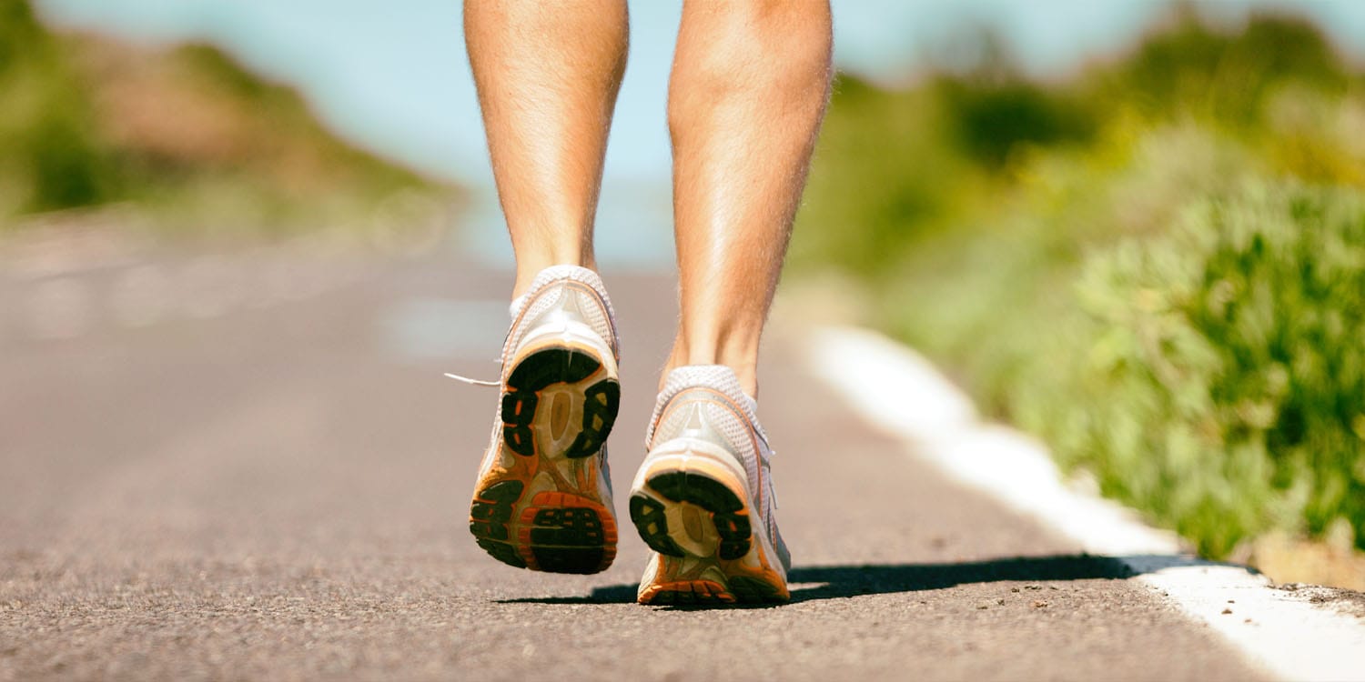 man jogging feet closeup running shoes
