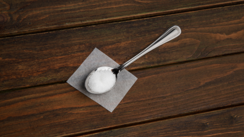 tablespoon of sweetener on wooden table freepik