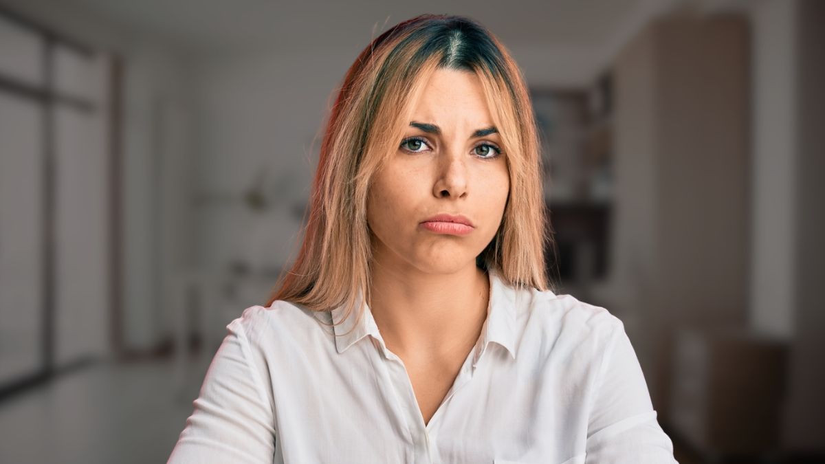 woman sad in her home office
