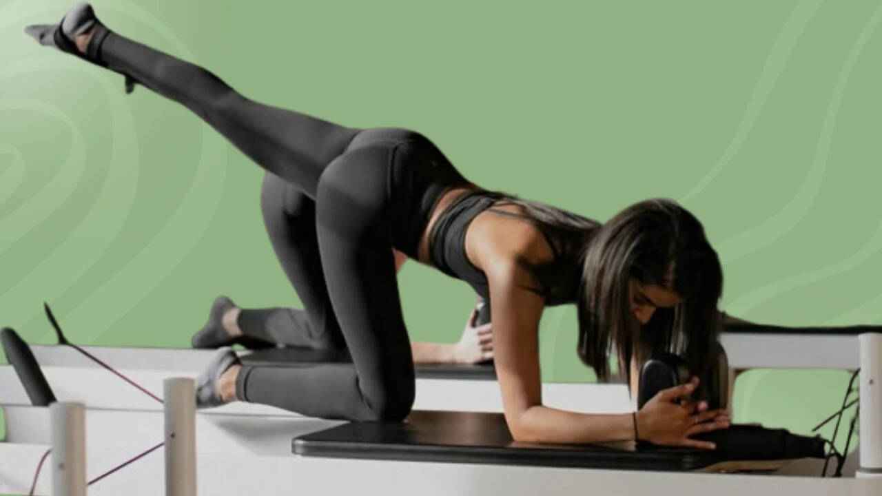 Swivel, stretch, repeat! Employees are turning their everyday chairs into full-on Pilates equipment 1 129815356