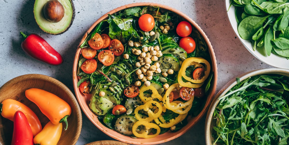 close up of womans hand holding a bowl of fresh royalty free image 1772229698