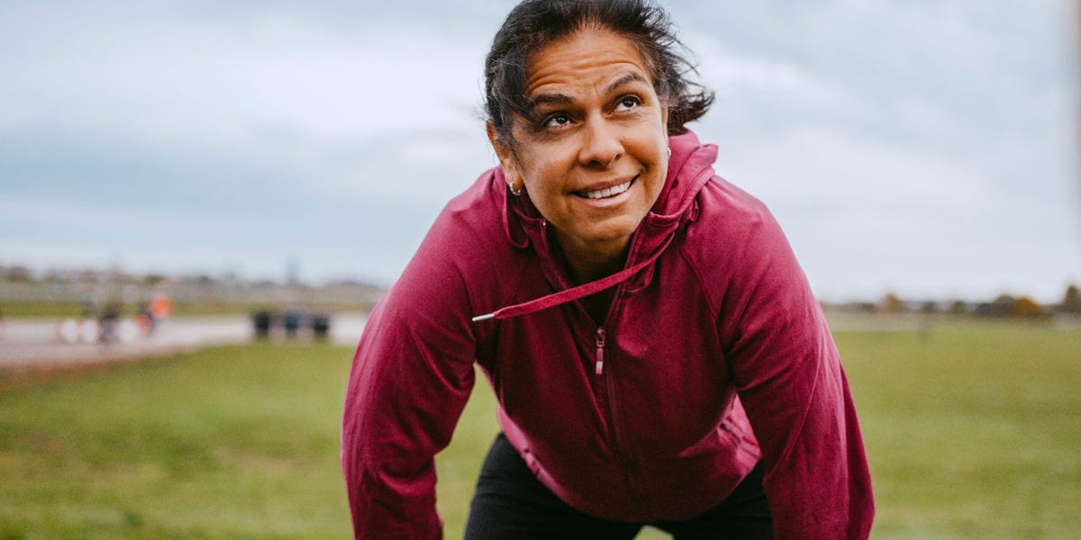 tired mature woman standing in park royalty free image 1772712825