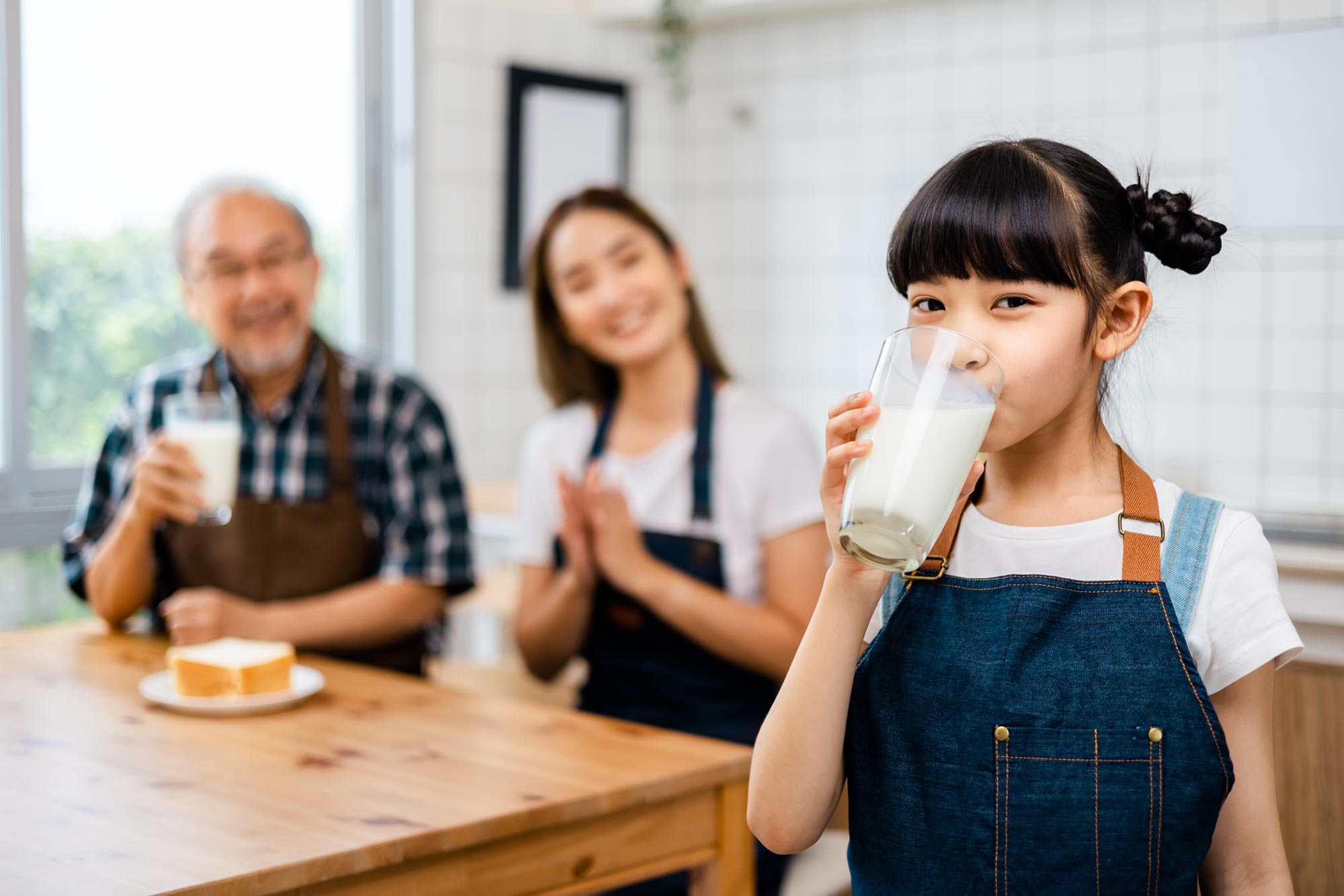 Asian Family Little Girl Drinking Milk