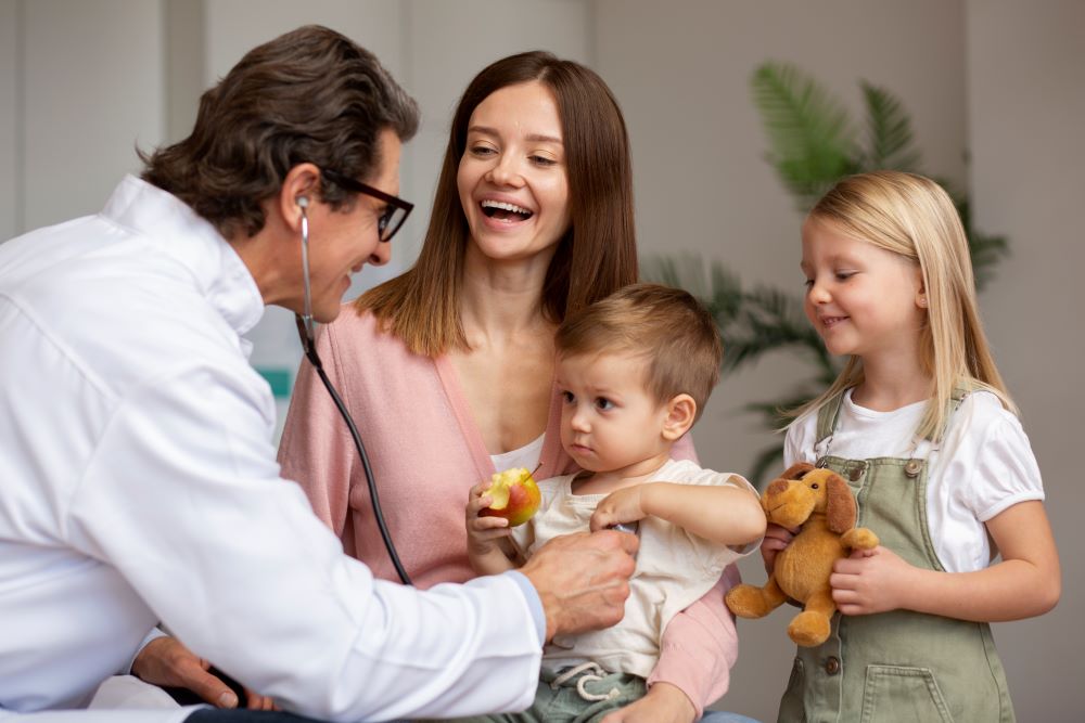 young mother with her children pediatrician appointment