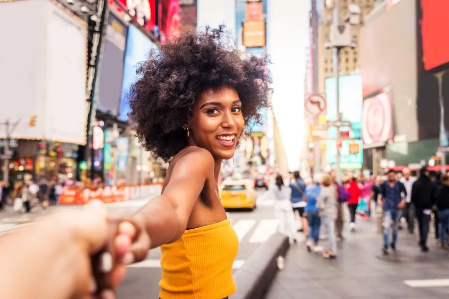 639142695287121666A woman in TImes Square grabbing someone else s hand