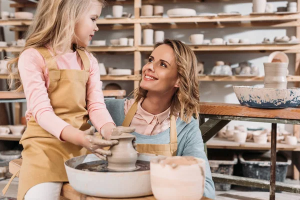 depositphotos 189410448 stock photo female teacher child making ceramic 1