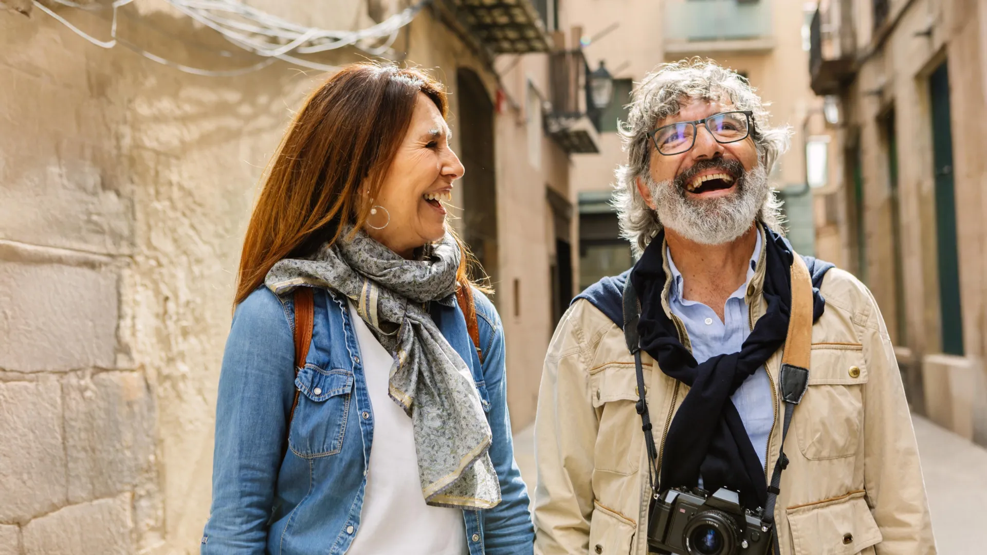 happy senior couple sightseeing in barcelona