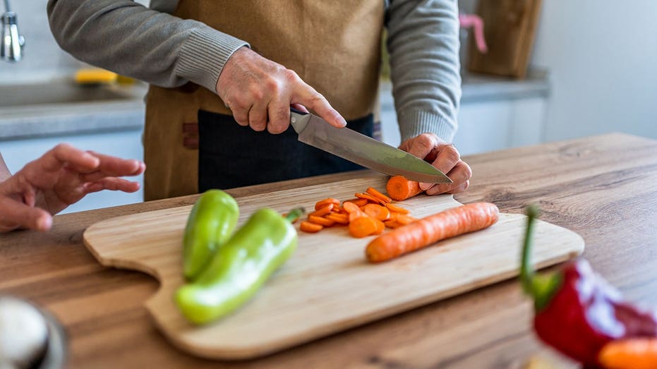 man slicing carrots kitchen fox news 001