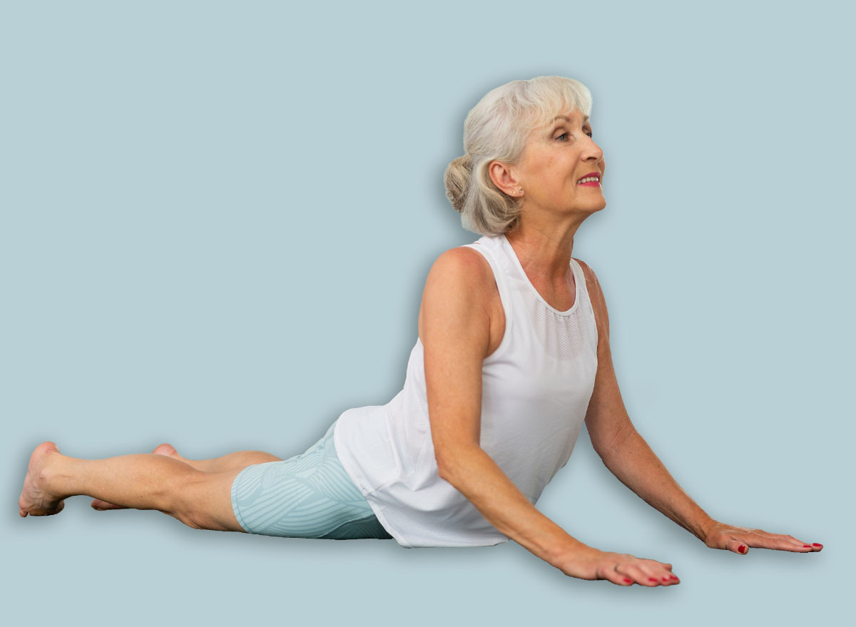 mature woman cobra pose yoga