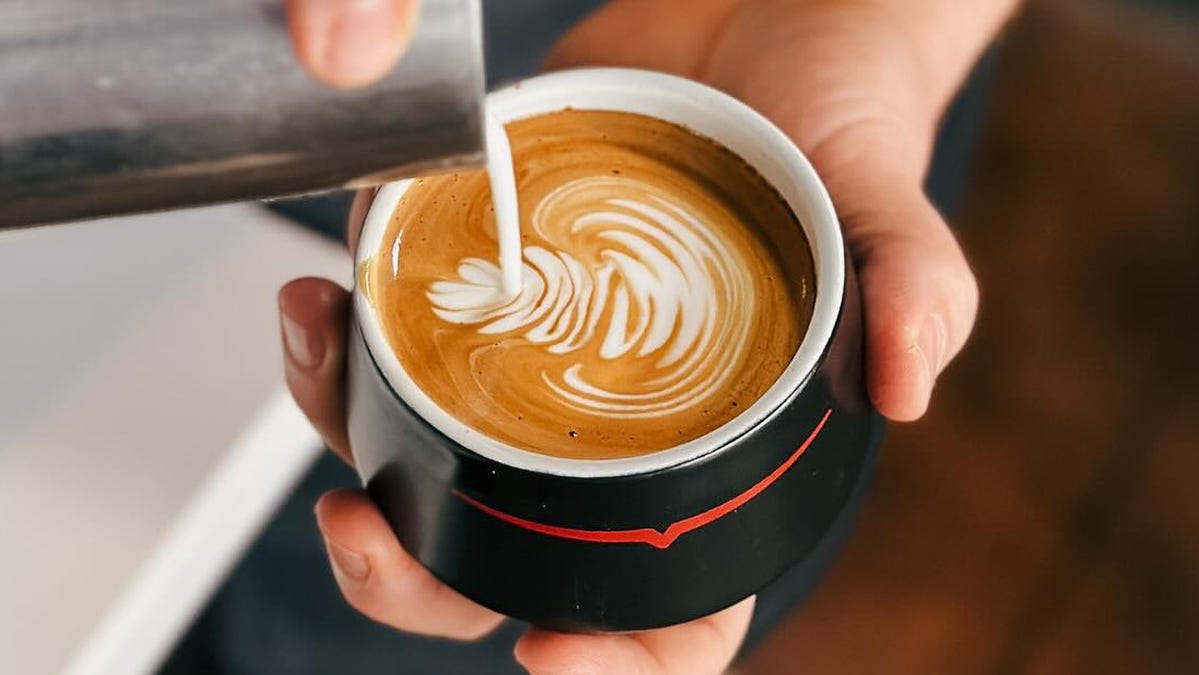 Popular coffee brand opening inside Sarasota Sprouts 3 90537246007 pouring latte art