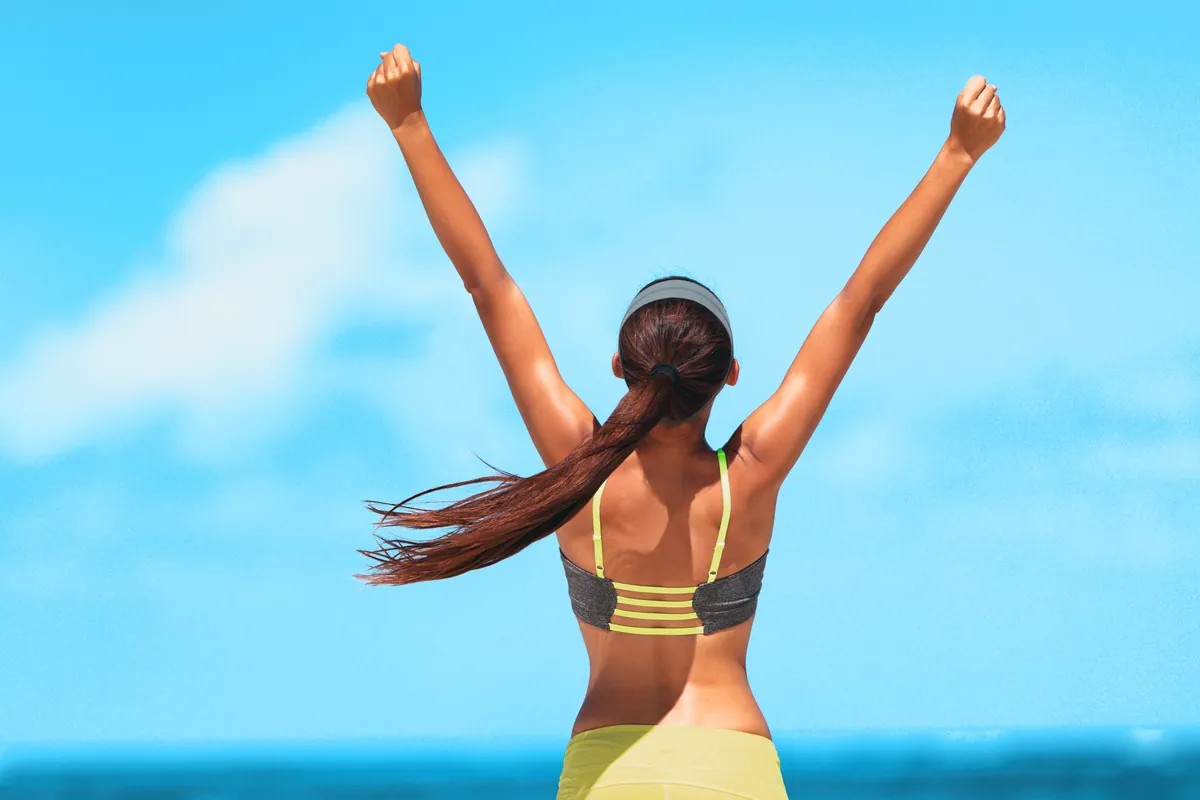 639190320761415865Goal achievement happy woman with open arms outdoors in success